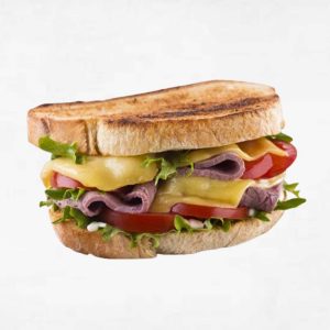 Roast beef , tomato relish and cheese sandwich